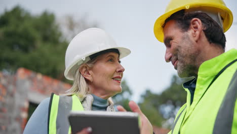 construction workers discussing project on site