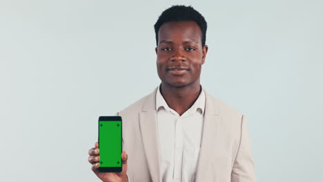 Businessman,-hand-and-pointing-to-phone-with-green