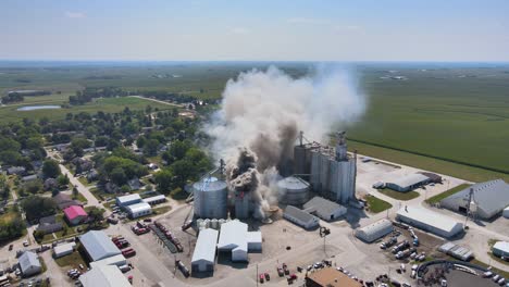 aerial over an industrial fire in a grain silo storage facility on a farm in iowa