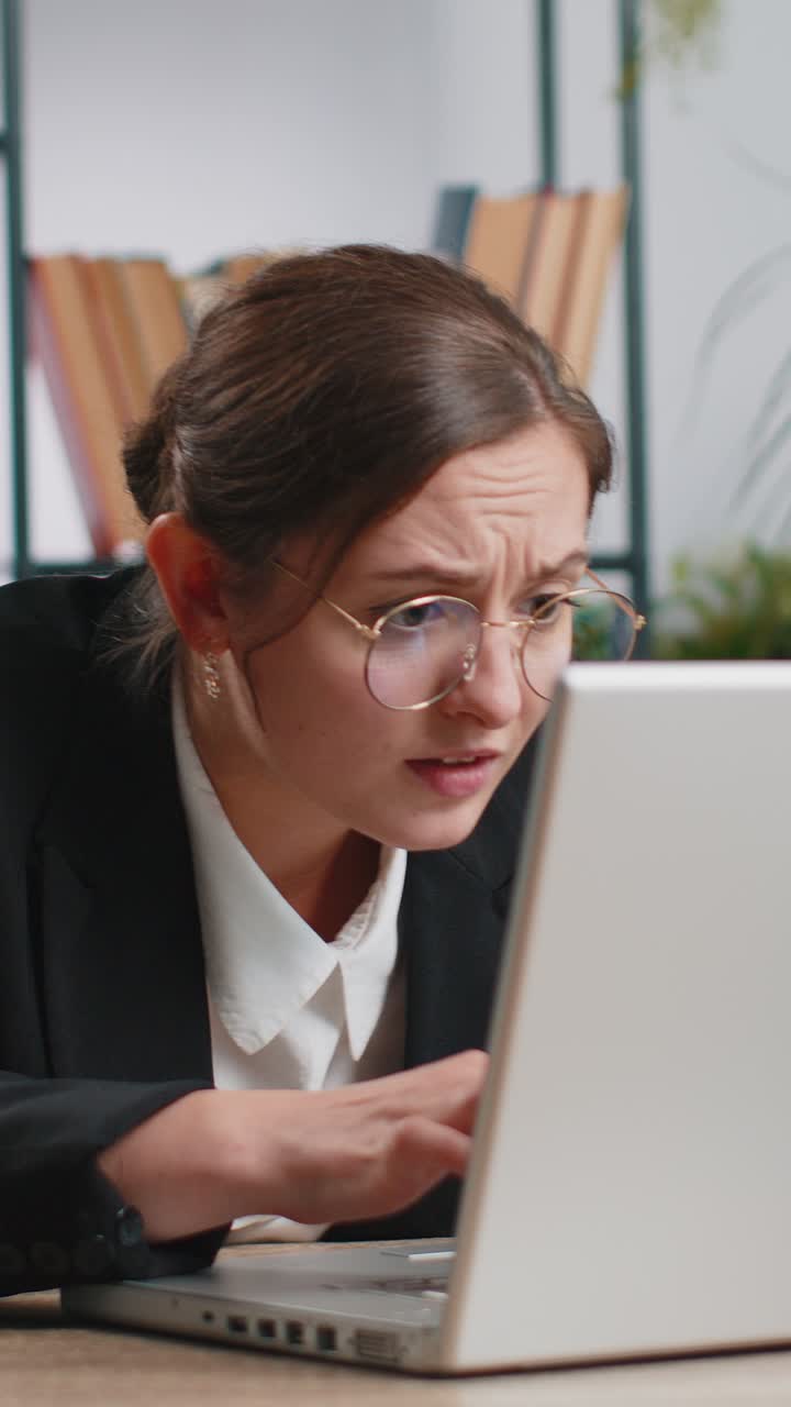 Irritated tired businesswoman working on laptop website problem computer virus data loss by hacking