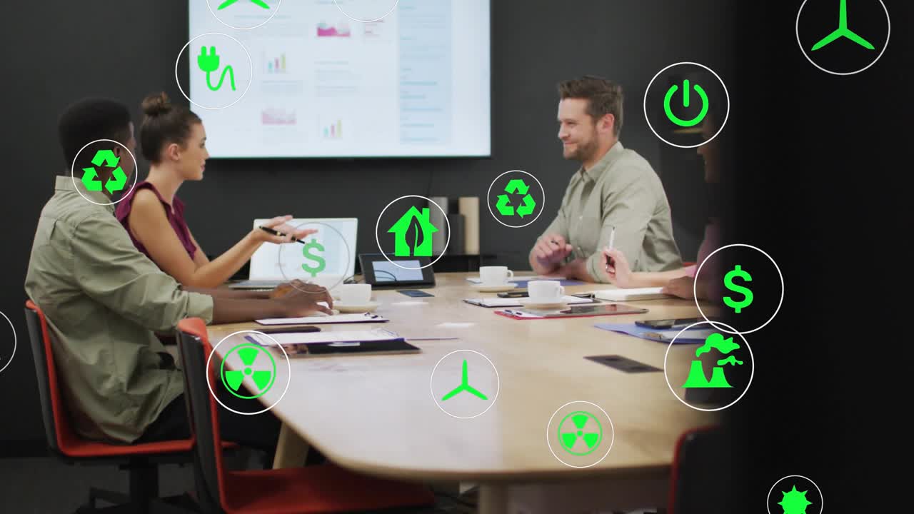 Cam pulling back revealing four colleagues at energy meeting, woman gesturing, icons overlaying
