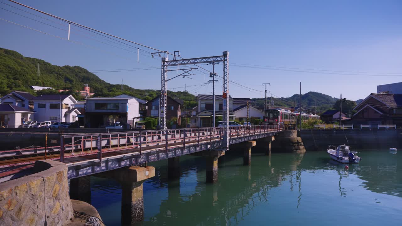 Train Passing Tadano-Umi Station in Hiroshima, Okunoshima Ferry Port in Japan
