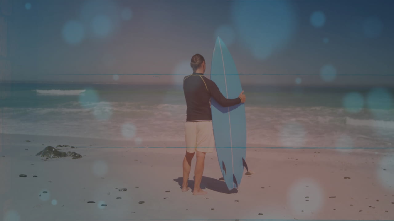 Mature man holding surfboard on beach featuring health-themed animated wave chart and weather icons