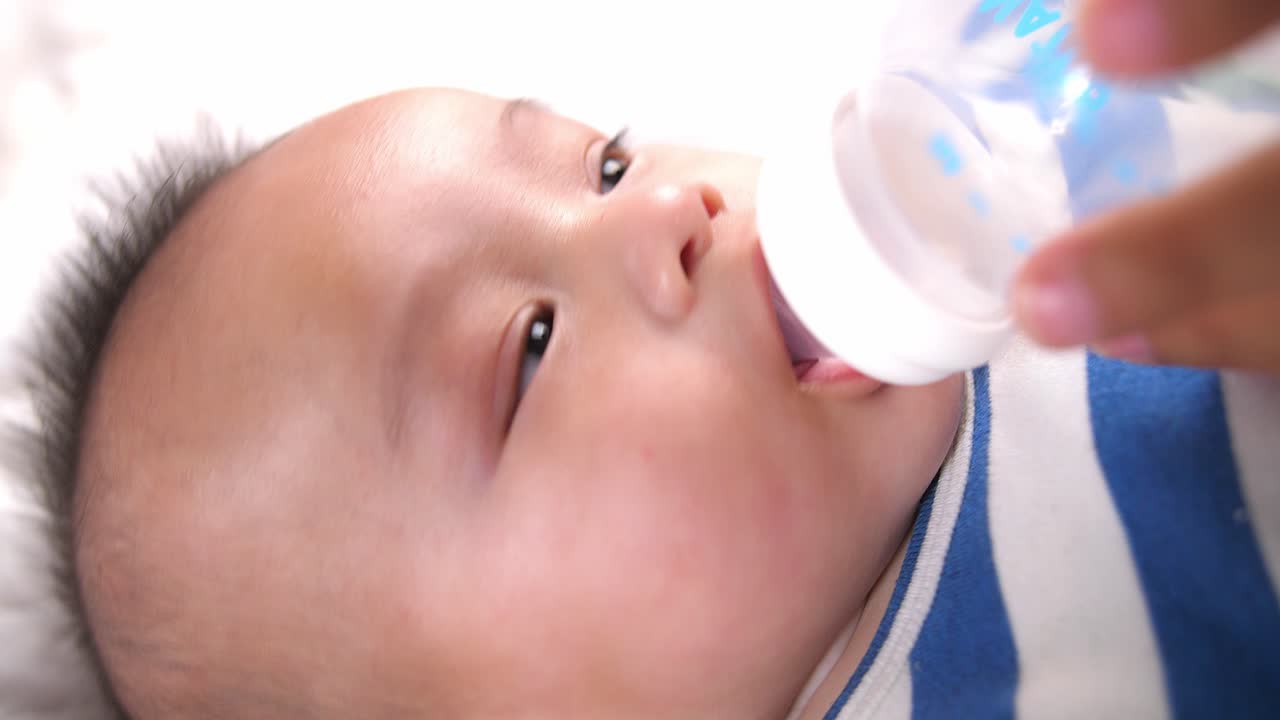 Baby Drinking Water From Bottle, Video In 4K