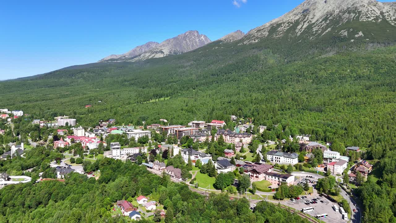 Aerial drone footage of the city of Starý Smokovec located in the High Tatras Mountains of Slovakia. The video captures beautiful mountain landscapes, architecture, and natural scenery from above