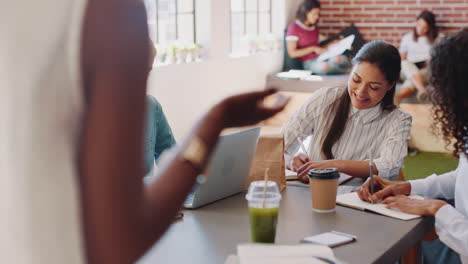 Businesswomen-listening-to-presentation