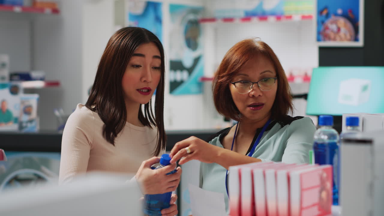 Pharmacist assisting customer at pharmacy counter