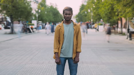 man standing in city street