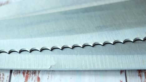 close-up of a serrated knife blade