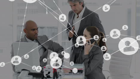 animation of network of profile icons against diverse businesspeople discussing at office