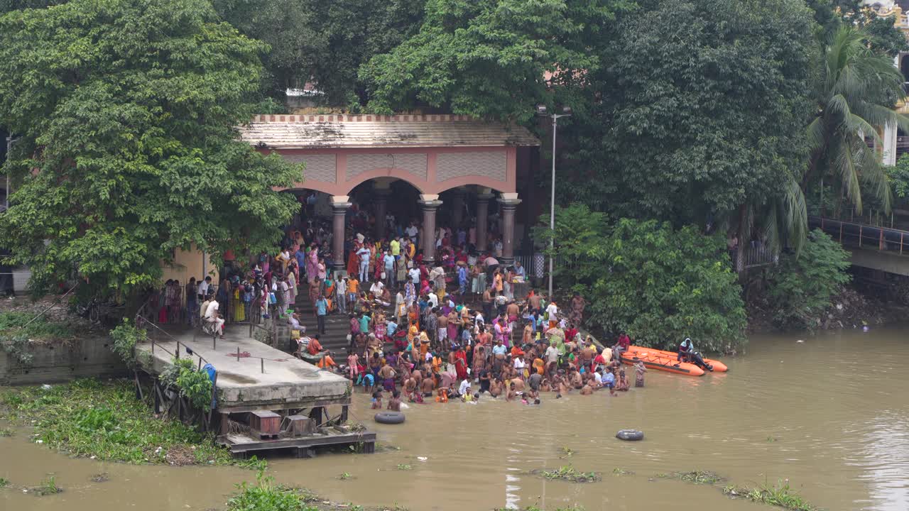 Gathering of people and Tarpan at Dakshineswar Temple in Kolkata on Mahalaya day on the eve of Durga Puja.