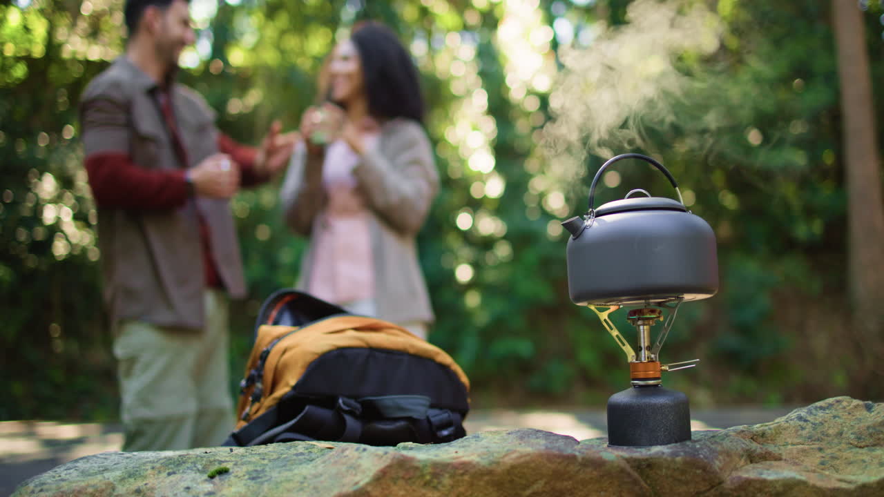 Camping in the forest with kettle