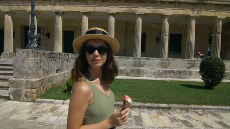 tourist woman walking at ancient city at sunny day. woman traveling at vacation