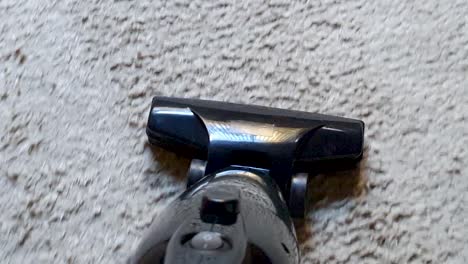 vacuum cleaner performing carpet cleaning in a vertical and diagonal back and forth motion