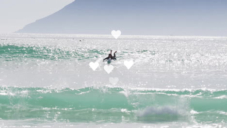 woman paddling prone on surfboard in wetsuit, using digital marketing overlay with heart icons