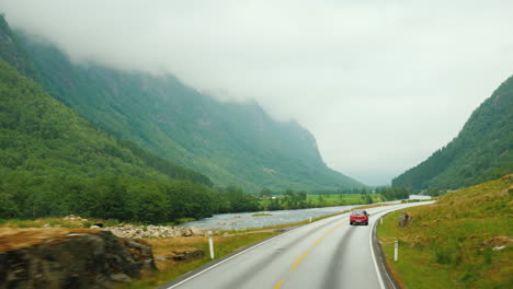 go along the scenic road among the mountains of norway first-person view