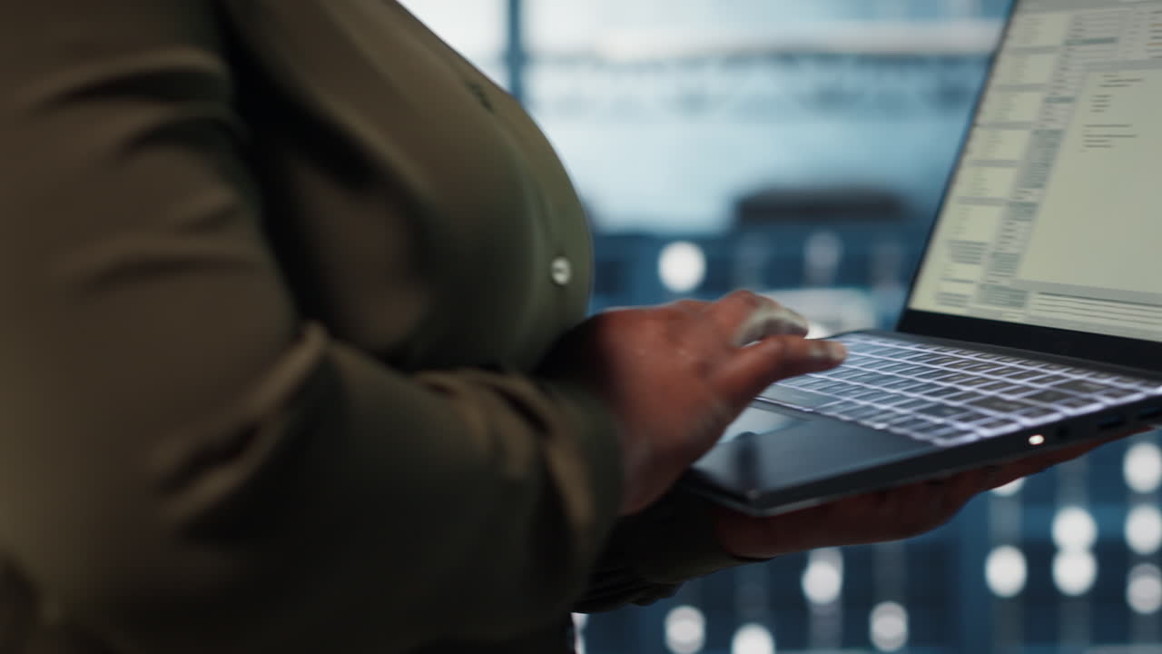 Close up of software developer working in data center to optimize network