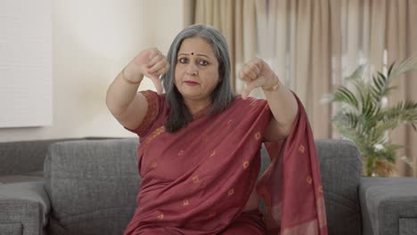 Disappointed-Indian-old-woman-showing-thumbs-down