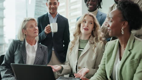 diverse business team collaborating on project in office