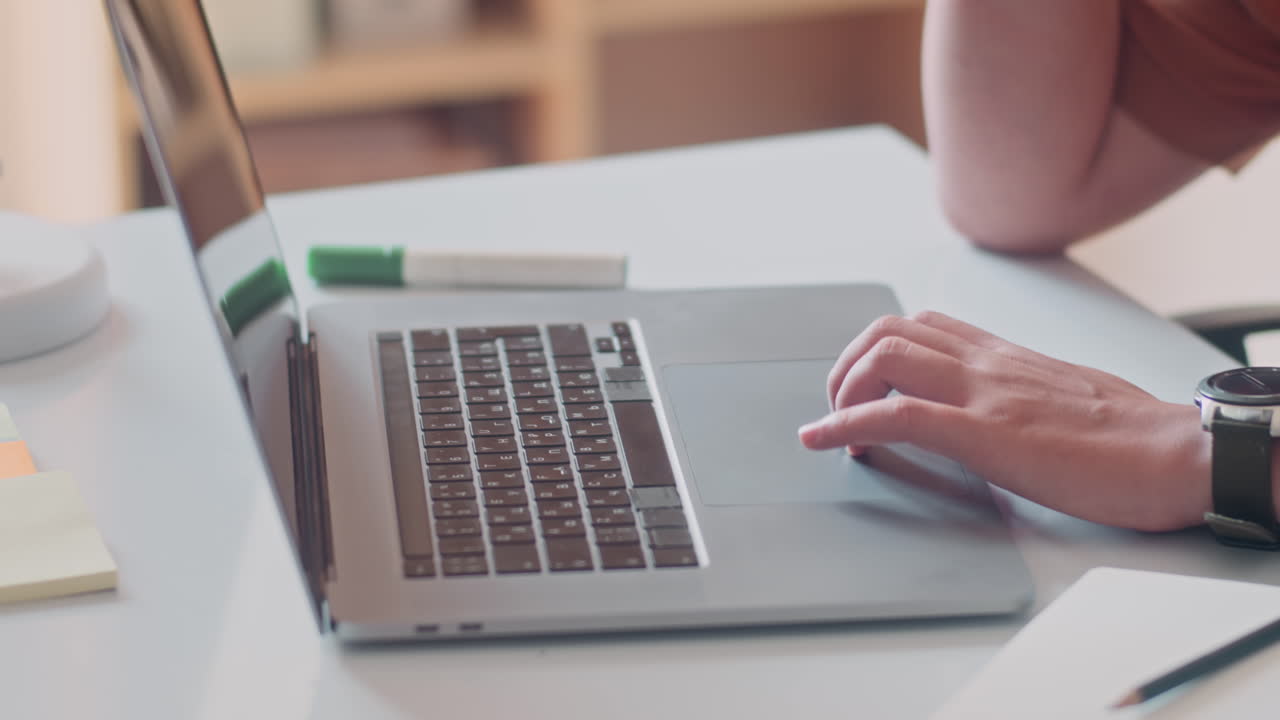 Asian Entrepreneur Calling Client on Phone and Using Laptop