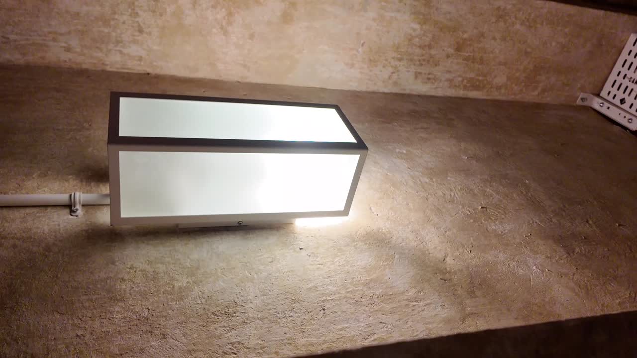 Indoor lighting fixture on textured wall