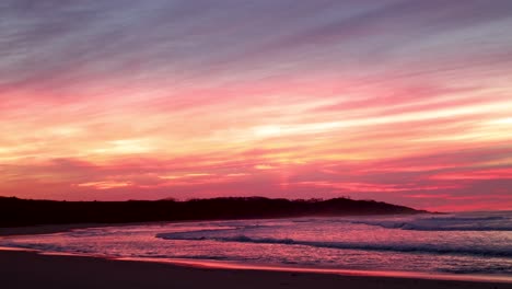 amazing pink sunrise over an inlet in northern victoria on the ocean