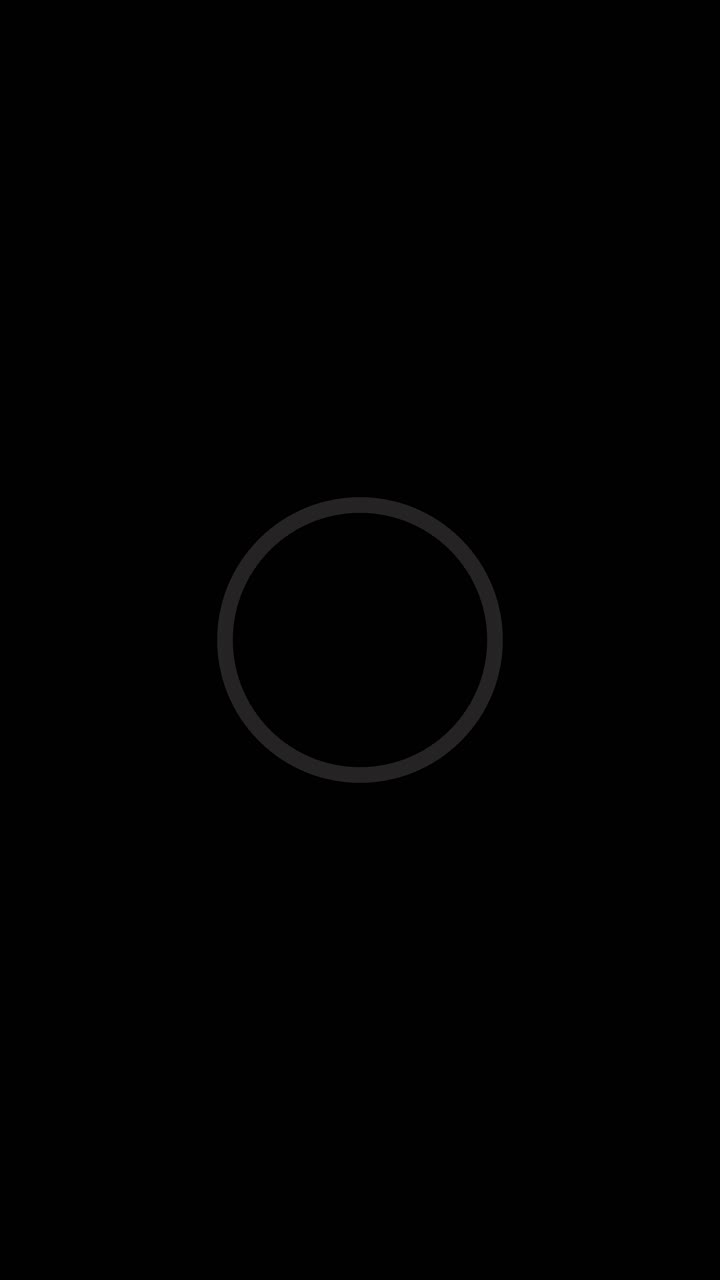 Video footage of black white ring animation rotating loop glowing against dark background for