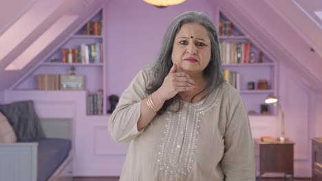 indian old woman getting shocked by watching something