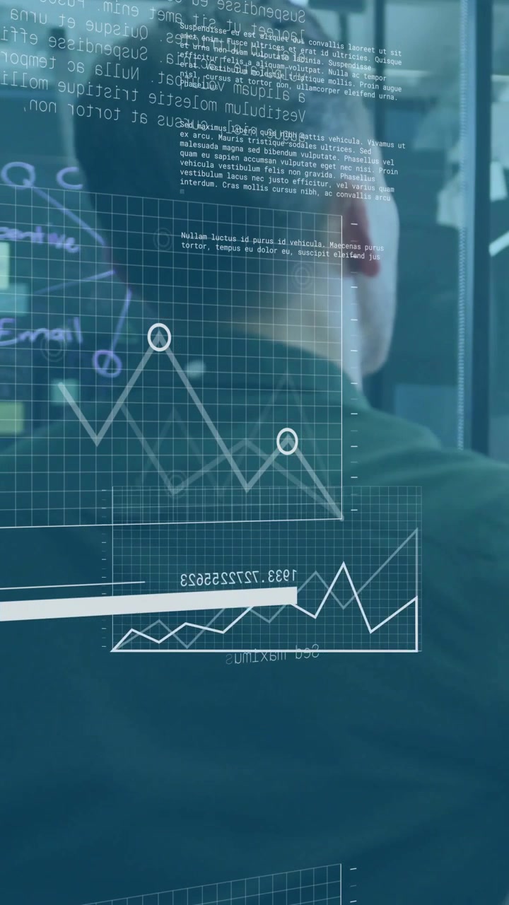 Vertical video: Analyst at glass observing HUD appearing and animating CRM charts for review