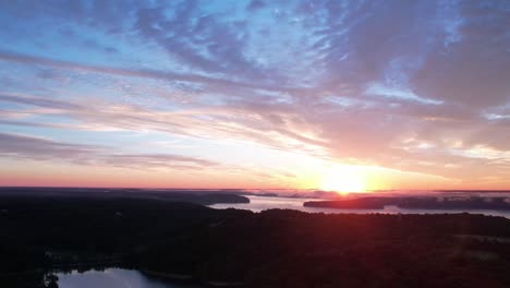 aerial time lapse of clouds peacefully drifting over lake monroe at sunrise