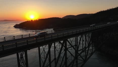 Rising-aerial-shot-of-cars-commuting-over-Deception