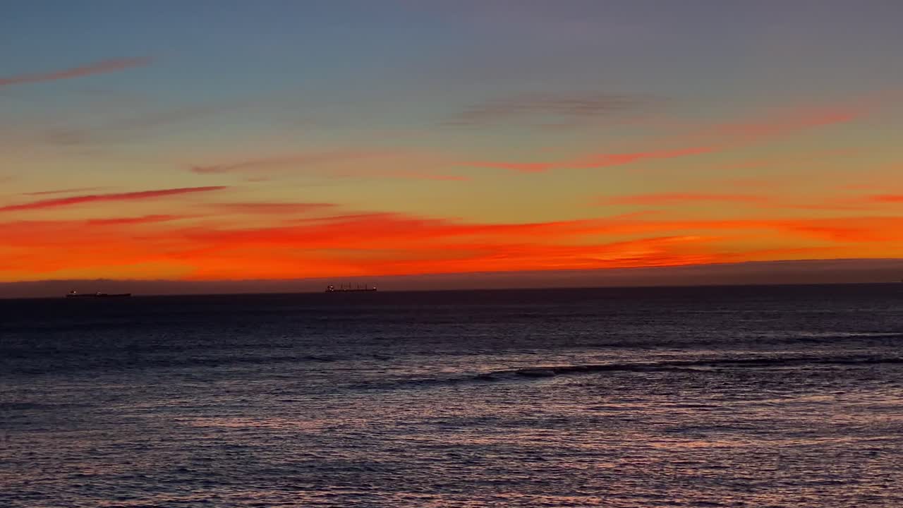 Lisbon Portugal wide shot 4K, aerial view city skyline sunset over ocean timelapse at Cascais district