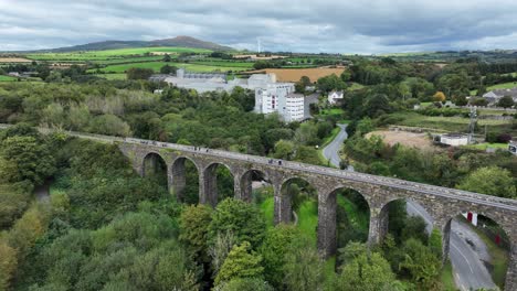 ireland epic locations kilmacthomas viaduct on the waterford greenway drone flying over people to a mill in dramatic co. waterford landscape irelands beauty