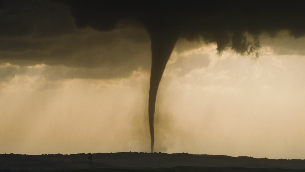Powerful Tornado Touchdown Creating Dust Cloud in Open Countryside