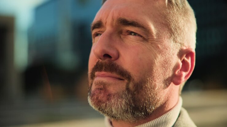 Close-up portrait of a mature man with a beard