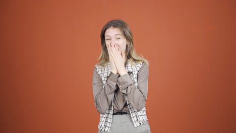 young woman looking at camera in amazement.