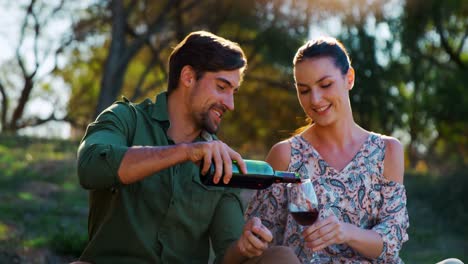 Man-pouring-wine-into-womans-glass-4k