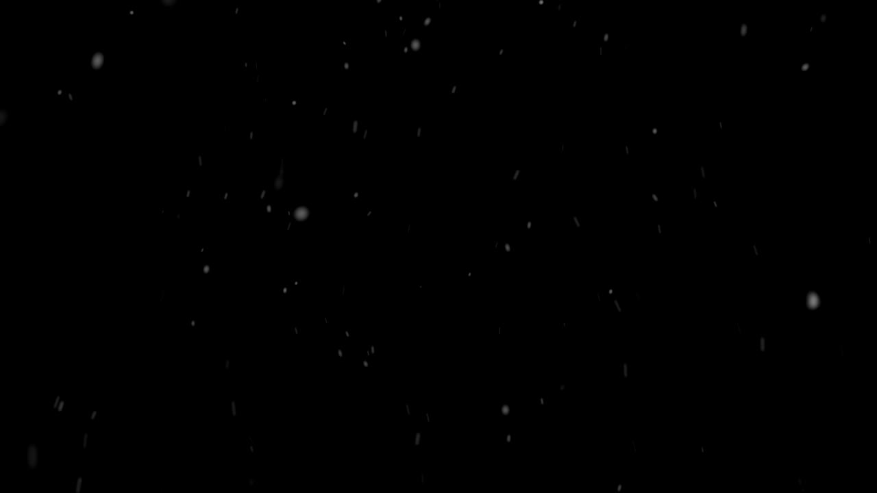 Heavy snow falling on black background looped | Premium Stock Video Footage