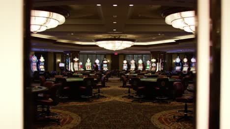 illuminated casino interior showcasing vibrant gaming machines and poker tables, creating an immersive atmosphere for visitors seeking entertainment and leisure.