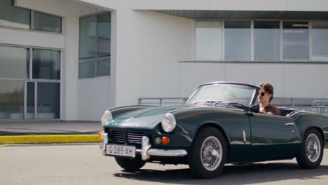 couple in a classic convertible car