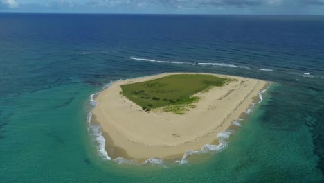 aerial circling of island near montecristo bay. dominican republic