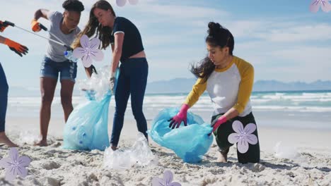 animation of flowers over diverse female and male volunteers picking up rubbish on beach