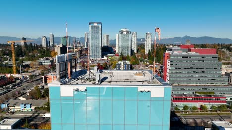 pullback reveal of surrey memorial hospital rooftop with helipad in surrey, british columbia, canada