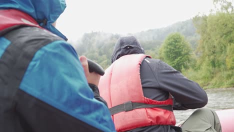 rafters are paddling down the whitewater during the