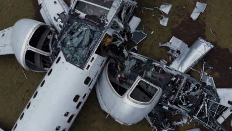 damaged airplane wreckage on a field