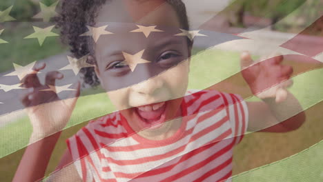 animation of flag of united states of america over happy african american girl