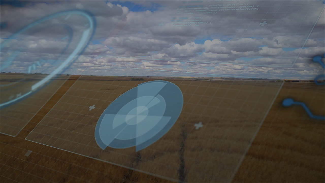 Futuristic data interface animation over vast agricultural field under cloudy sky
