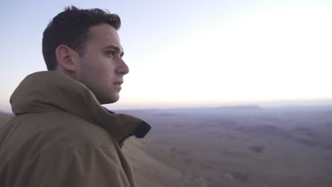 traveler looking at the desert view during sunrise