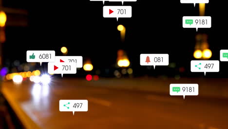 animation of social media icons and numbers over out of focus city and traffic lights