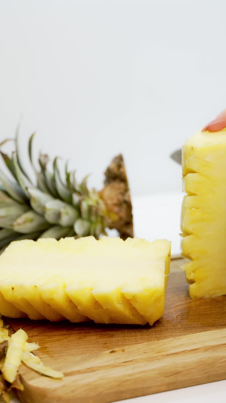 Pineapple cut with knife. Close up view of cut the pineapple with knife